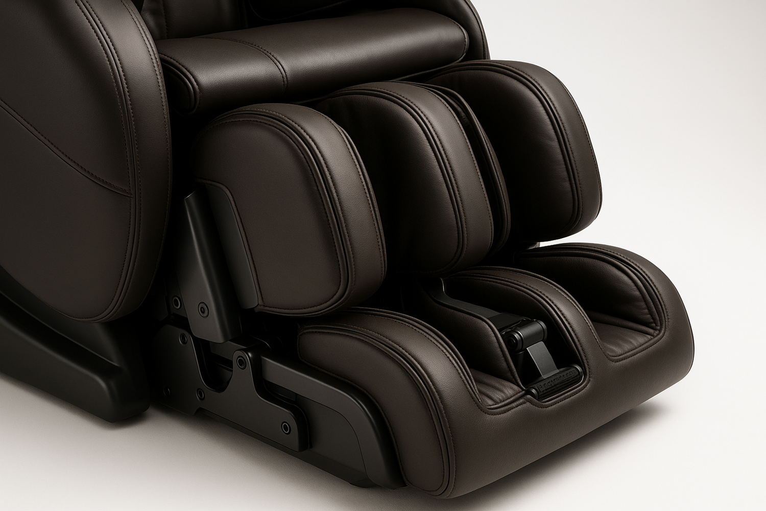 Generate me an image of a closeup on the foot holding section of a luxurious high end massage chair on a white studio background.