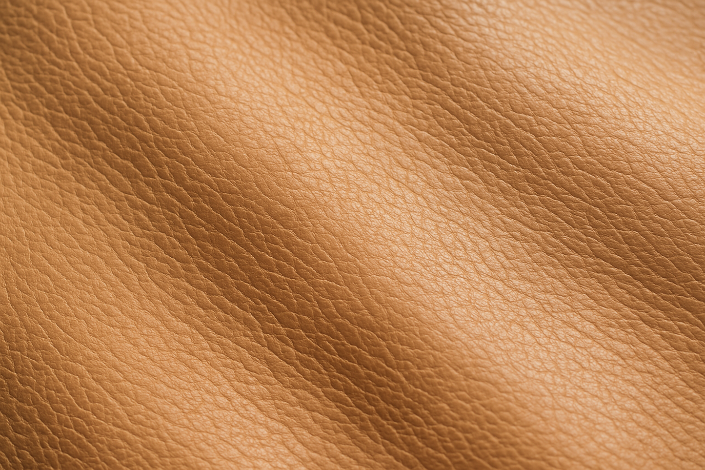 Generate me an image of a very close angled zoom from the top on light tan leather
