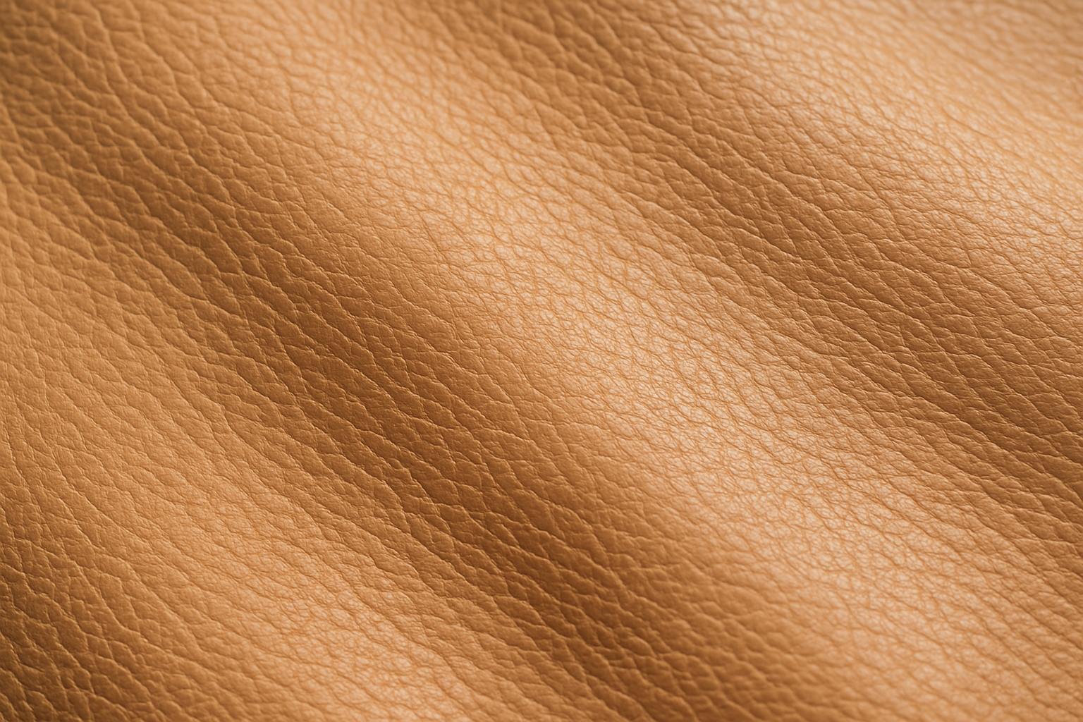 Generate me an image of a very close angled zoom from the top on light tan leather